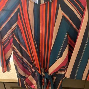 Graphic front tie blouse w zipper in back and button closure
